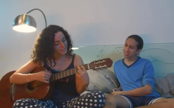 Stock Video Couple Hanging Out While She Plays Guitar For PC