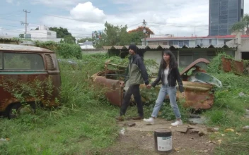 Stock Video Couple Exploring An Old And Abandoned Place For PC