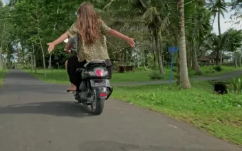 Stock Video Couple Enjoying A Scooter Ride On Their Vacation For PC