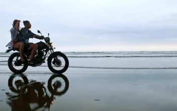 Stock Video Couple Enjoying A Motorcycle Trip On Their Beach Vacation For PC