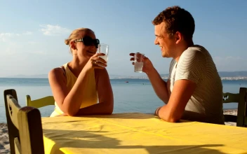 Stock Video Couple Enjoying A Drink At The Beach For PC