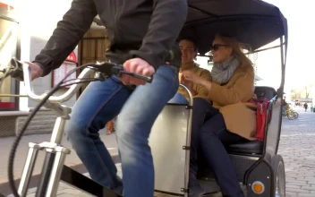 Stock Video Couple Enjoying A Bicycle Taxi Ride For PC