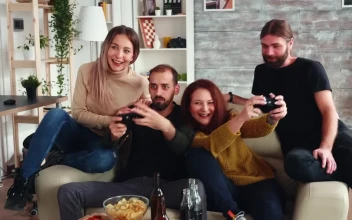 Stock Video Couple Enjoy Friendly Gaming Competition At Home For PC