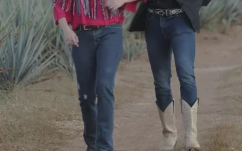 Stock Video Couple Dressed As Charros Walking Through A Farm For PC