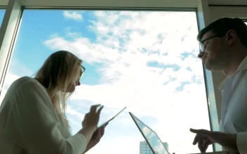 Stock Video Couple Dancing While Working For PC