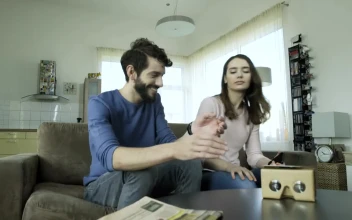 Stock Video Couple Assemble Cardboard Lenses For Virtual Reality For PC