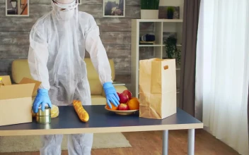 Stock Video Coronavirus Quaratine Grocery Delivery Man Packs Food For PC