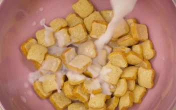 Stock Video Corn Flakes Cereal Texture In Bowl With Milk For PC