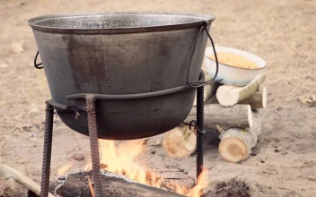 Stock Video Cooking Outdoors With A Cauldron In The Campfire For PC