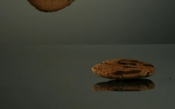 Stock Video Cookies Falling In Slow Motion To Mirror Surface For PC