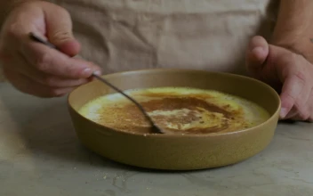 Stock Video Cook Mixing Ingredients In A Mixture For PC