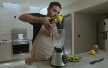 Stock Video Cook Adding Ingredients In A Blender For PC