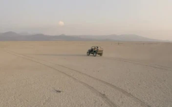 Stock Video Convertible Jeep Crossing A Large Desert In Aerial Shot  Smal For PC