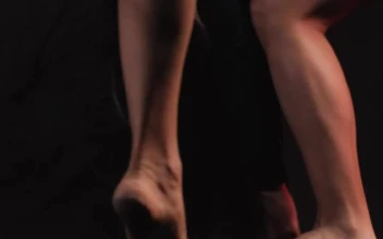 Stock Video Contemporary Dancers In A Dark Spot Knee Level Shot For PC