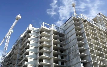 Stock Video Construction Crane Over A Building For PC