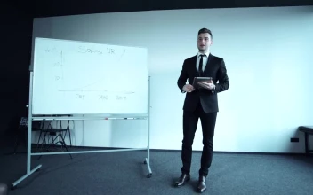 Stock Video Confident Young Businessman Doing A Presentation For PC