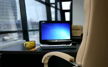 Stock Video Computer And Yellow Cup Near The Window Office For PC