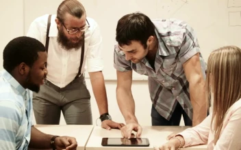 Stock Video College Team Checking Information On A Tablet For PC