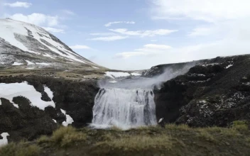 Stock Video Cold Waterfall Tumbling Over Rocks For PC