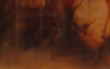 Stock Video Coffee Creamer Swirling In Coffee For PC