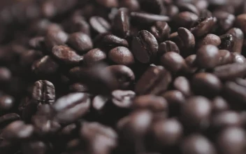 Stock Video Coffee Beans Falling On A Layer Of More Beans For PC