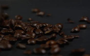 Stock Video Coffee Beans Falling Onto A Dark Cloth For PC