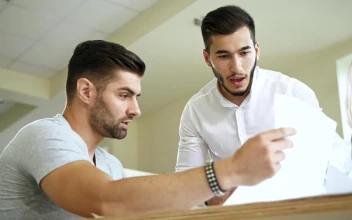 Stock Video Co Workers Reviewing A Document For PC