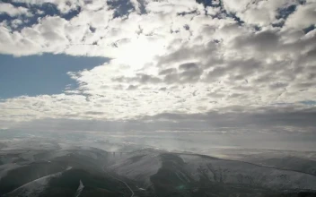 Stock Video Cloudy Sky Traveling Above The Mountains For PC