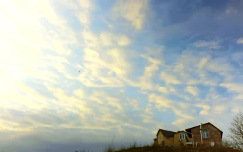 Stock Video Clouds Passing Over A Country House For PC