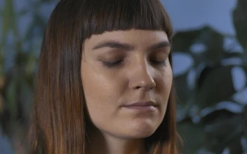 Stock Video Face Of A Woman Slowly Opening Her Eyes For PC