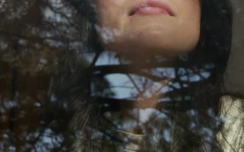 Stock Video Face Of A Woman Looking Through A Window For PC