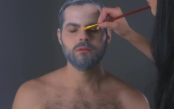 Stock Video Face Of A Man While Being Made Up For PC
