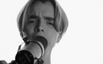 Stock Video Face Of A Man Singing In Front Of A Microphone For PC