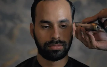 Stock Video Face Of A Man During A Haircut In A Barbershop For PC