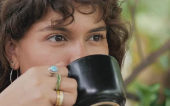 Stock Video Face Of A Girl Drinking Coffee While She Listens To For PC