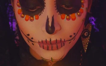 Stock Video Face Of A Catrina Putting Out A Candle On The For PC