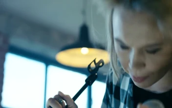 Stock Video Expressive Blonde Girl Singing With Microphone For PC