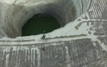 Stock Video Explorer Descending In A Deep Sinkhole For PC