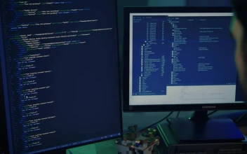 Stock Video Experienced Programmer Working On A Large Computer For PC