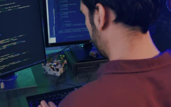 Stock Video Experienced Programmer Working On A Computer For PC