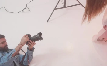 Stock Video Experienced Photographer During A Photo Shoot With A Model For PC