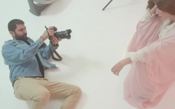 Stock Video Experienced Photographer Portraying A Girl On Set For PC