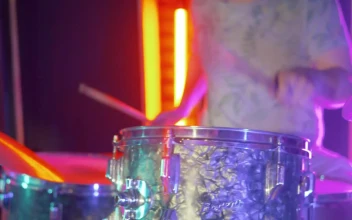 Stock Video Experienced Drummer Performing On Stage With Lights For PC