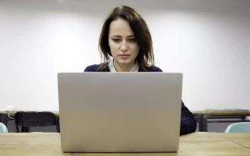Stock Video Exhausted Woman Working Late For PC