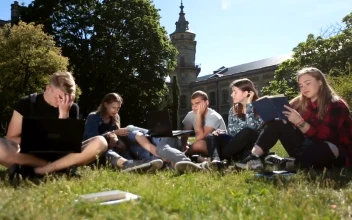 Stock Video Exhausted Classmates Studying In A School Garden For PC