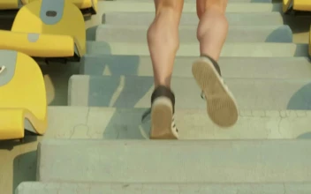 Stock Video Exercising By Climbing The Steps Of Some Bleachers For PC