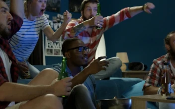 Stock Video Excited Friends Cheering At The Tv For PC