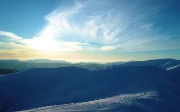 Stock Video Evening Sun Illuminating Snowy Mountains For PC