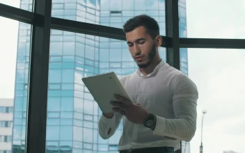 Stock Video Entrepreneur Working On A Tablet In His Office For PC