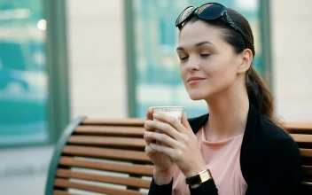 Stock Video Enterprising Woman Drinking Coffee Before Work For PC